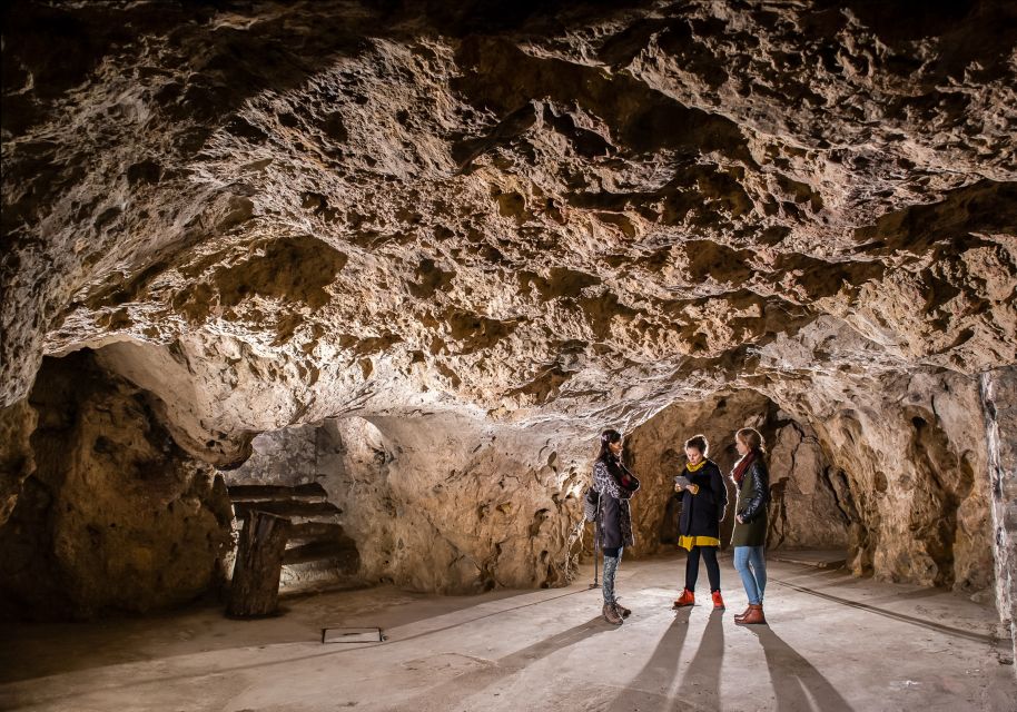 Budapest: Buda Castle Cave Tour - Wine cellars, bomb shelters, and a medieval prison: the human story layer
