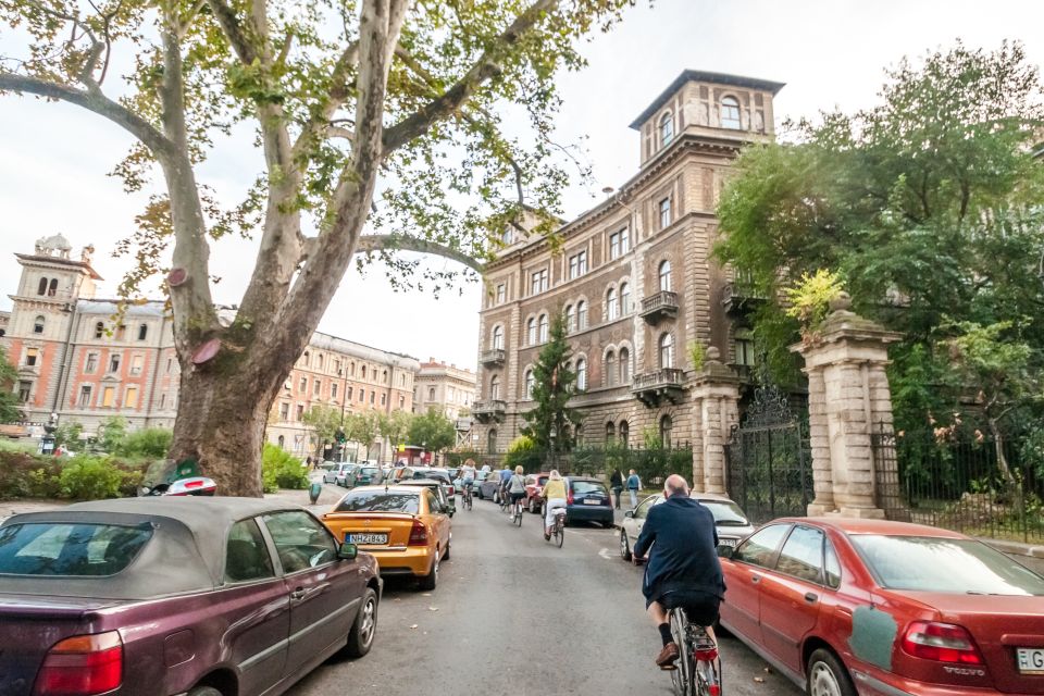 Budapest: Guided City Discovery Bike Tour - Back toward the basilika area: old streets, war-damaged buildings, and the Jewish Quarter